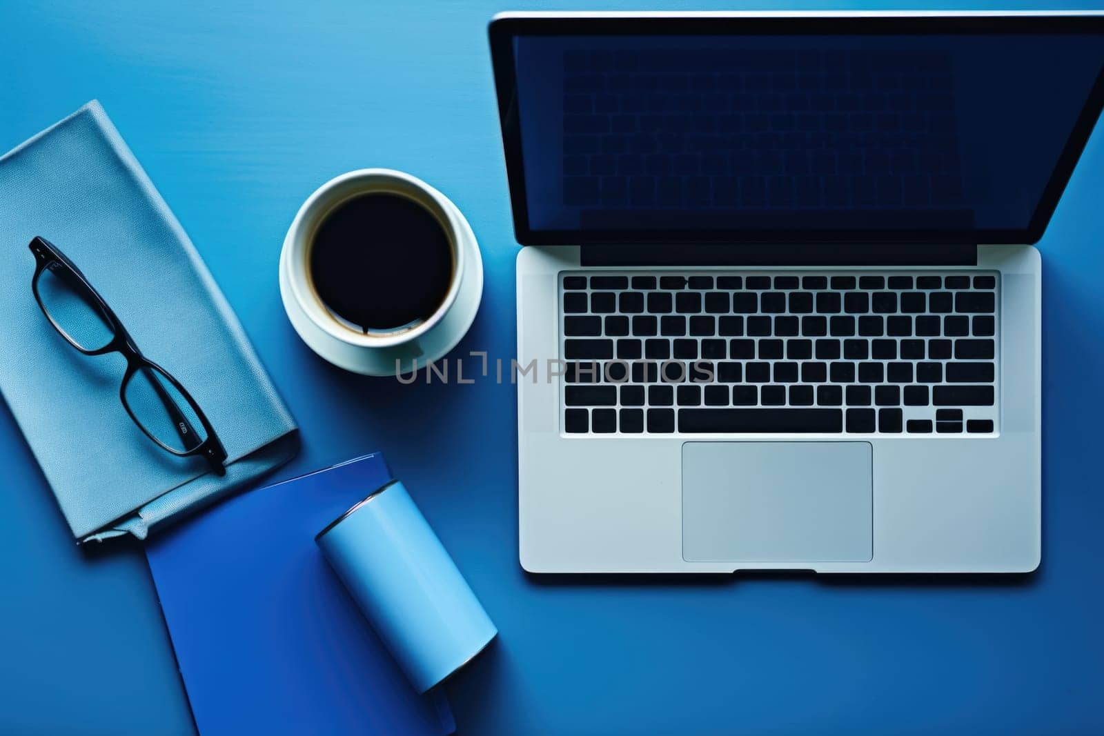 Blue Monday concept with laptop on desktop with blue wall, AI Generated