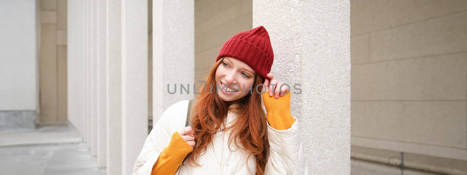 Happy redhead girl, tourist going around town, exploring sighsteeing places in city, backpacking around europe, enjoys travelling by Benzoix