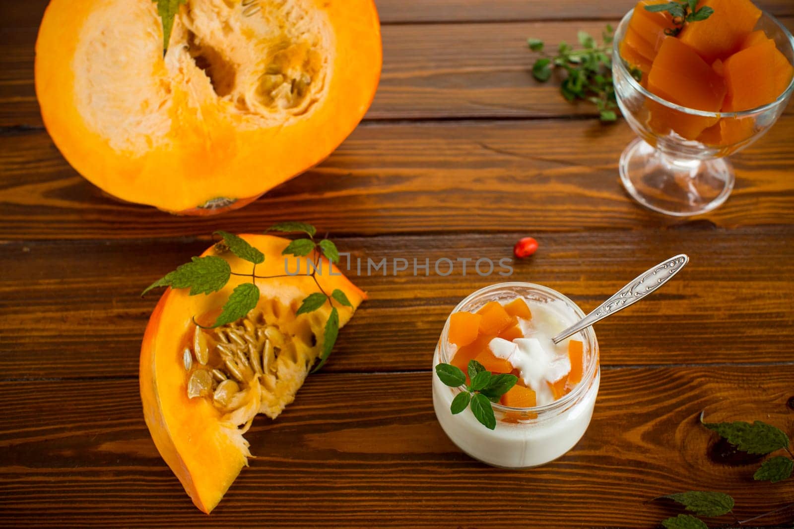 Homemade yogurt with pieces of pumpkin marmalade. Autumn recipes.