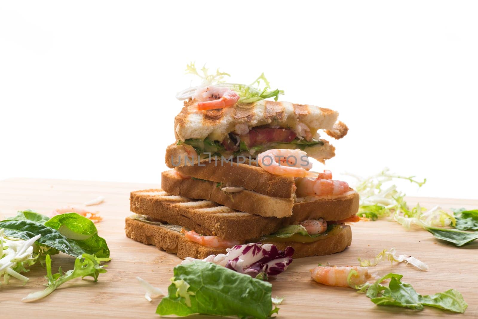 sandwich with lettuce and shrimp isolated on a white background.