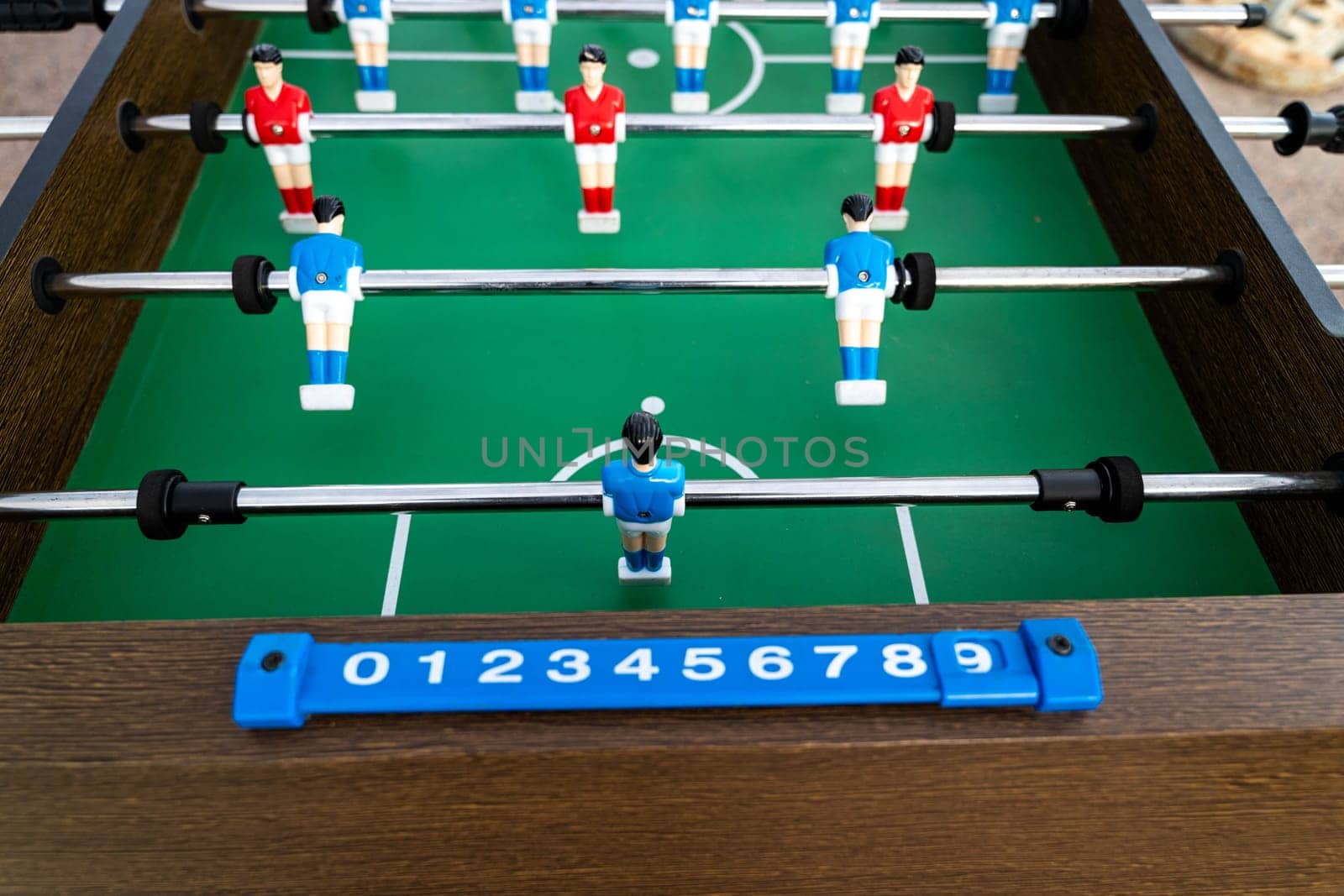 Close-up of figures of plastic players in a football match. by audiznam2609