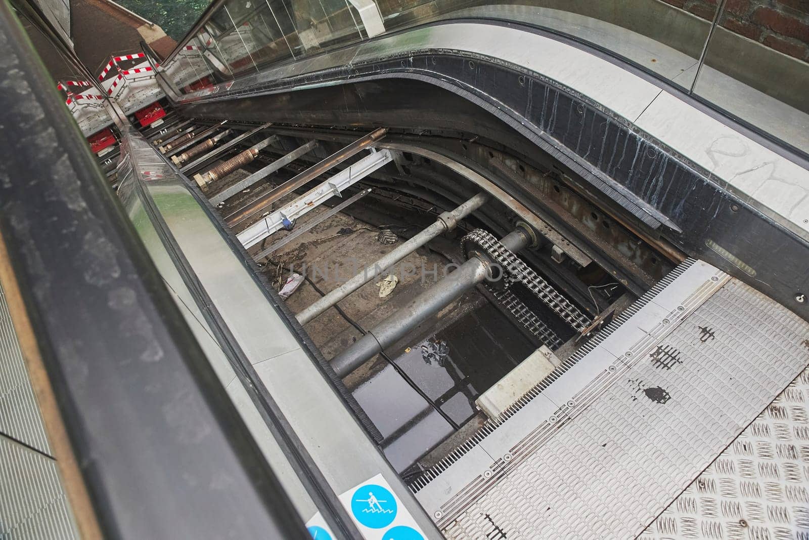 Broken escalator in the Netherlands. The insides are open.