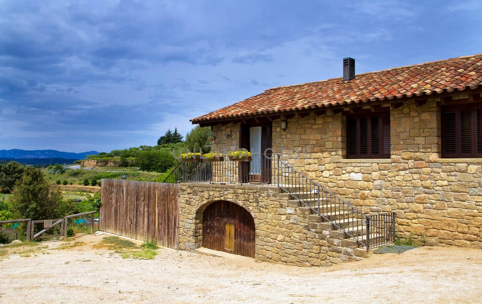 Large stone house, in the valleys of Catalonia - Catalonia Spain, spring day, blue sky.