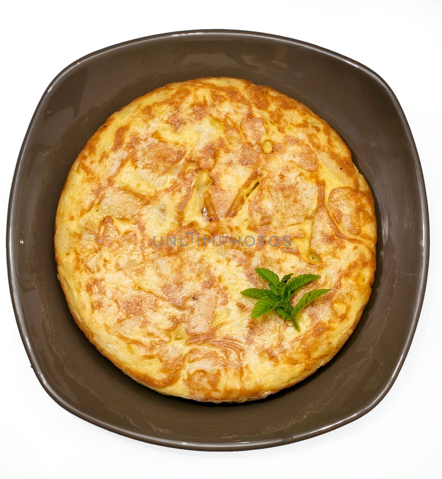 A triangle of potato Spanish omelette on a plate