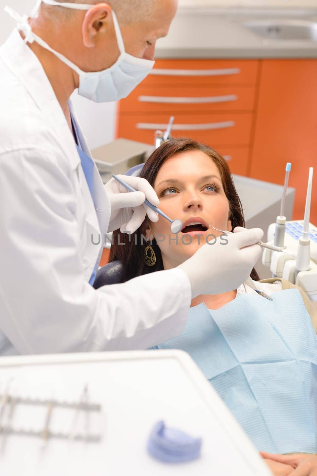 Scared patient at dentist office have teeth checkup stomatology