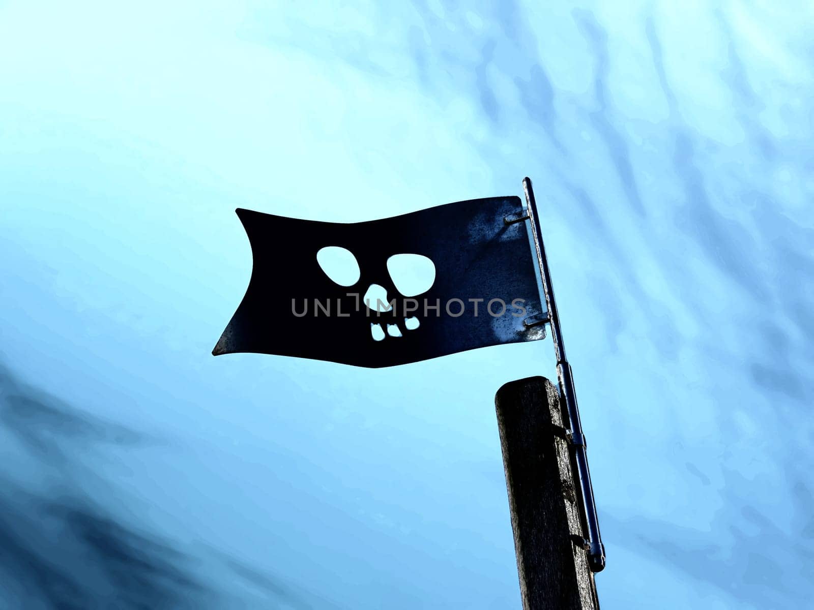 Flag of the pirates on the playground under blue sky - high contrast