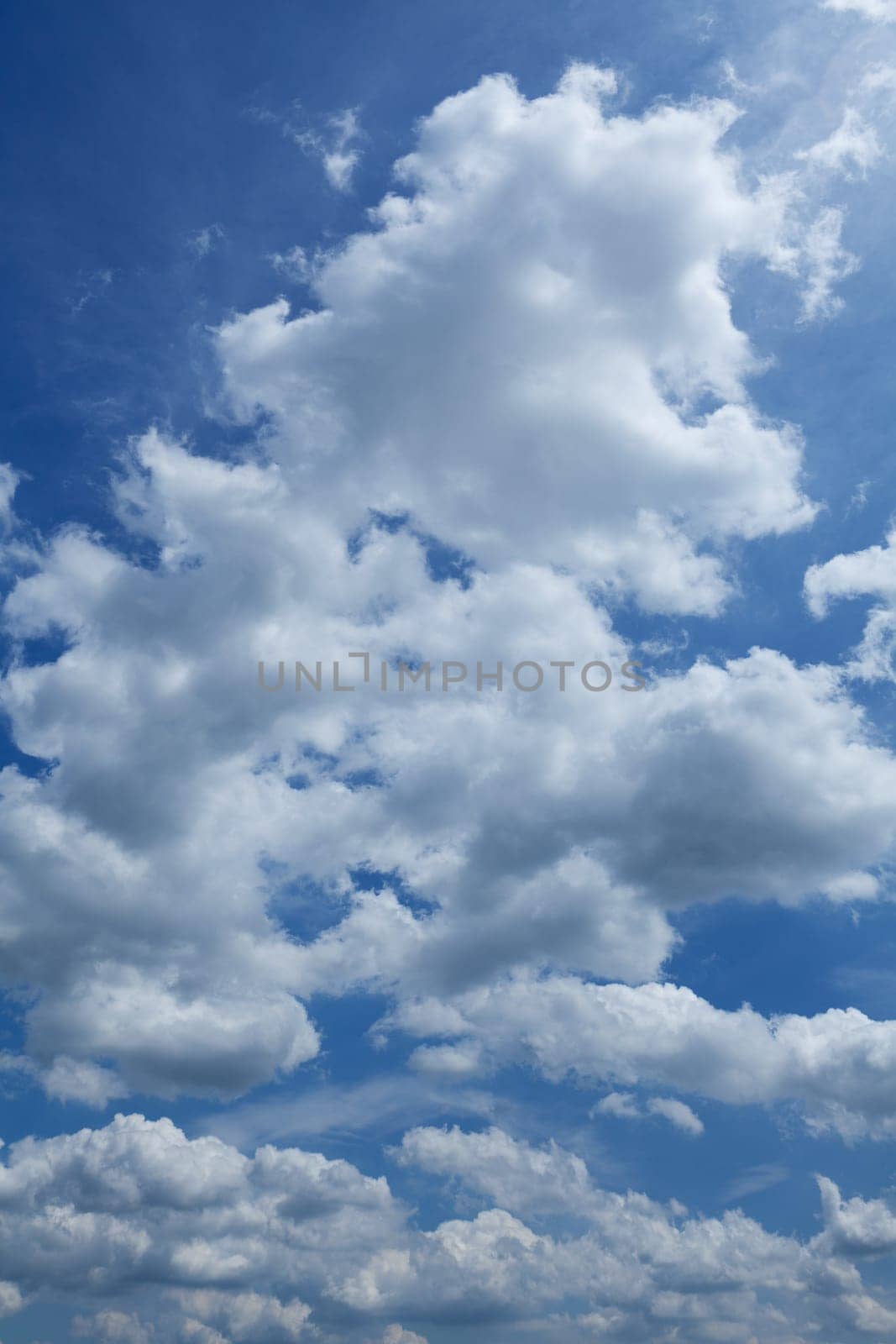 blue sky with cumulus clouds,also suitable as a background