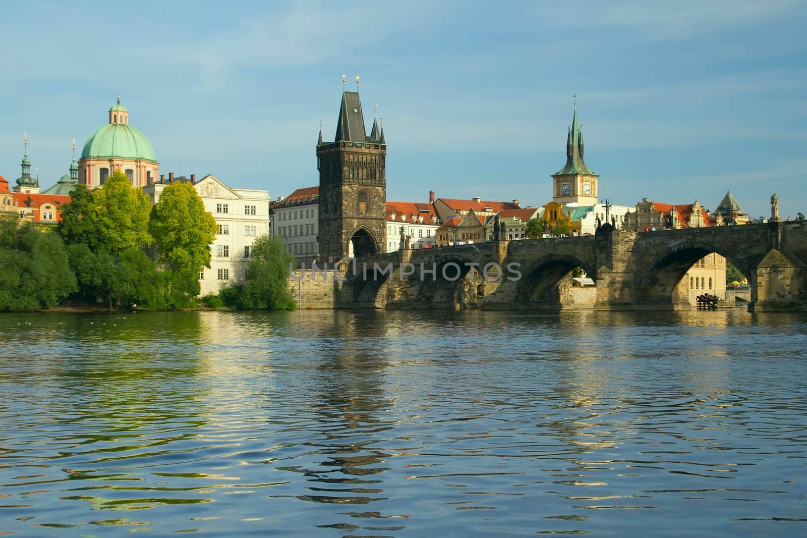 Charles bridge in Prague. The Vltava River in the foreground. (Czech Republic)