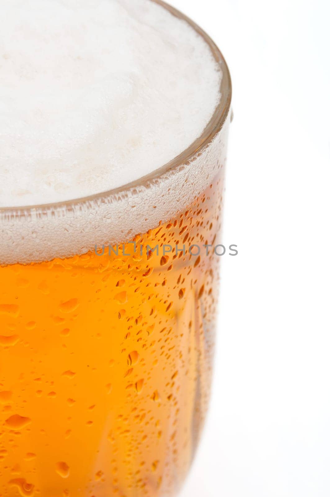 Closeup of Glass of Draught Beer on White Background - Shallow Depth of Field