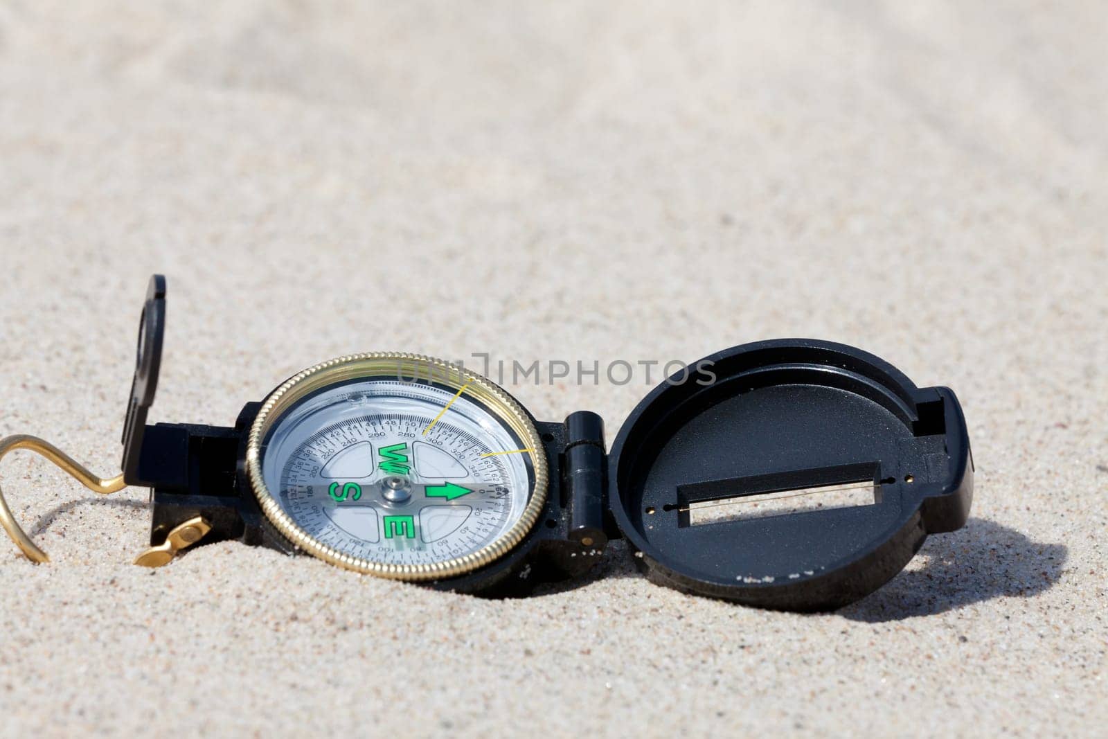 With the compass on a treasure hunt in the desert