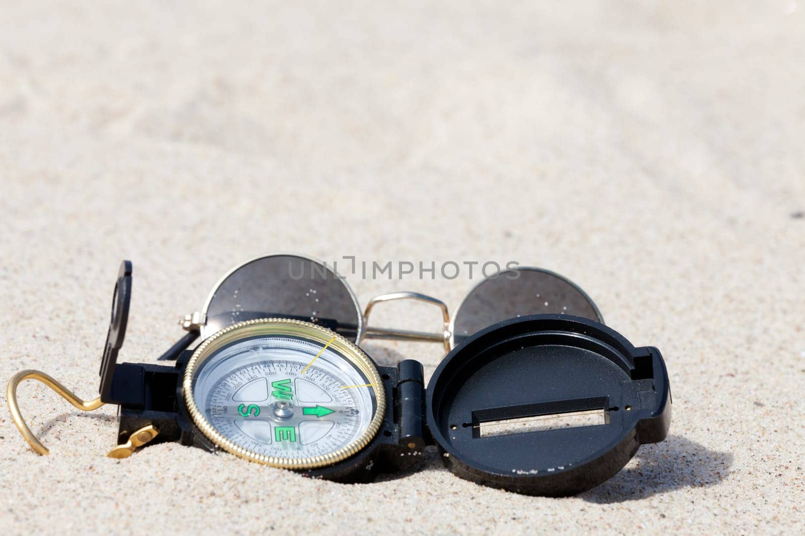With the compass on a treasure hunt in the desert