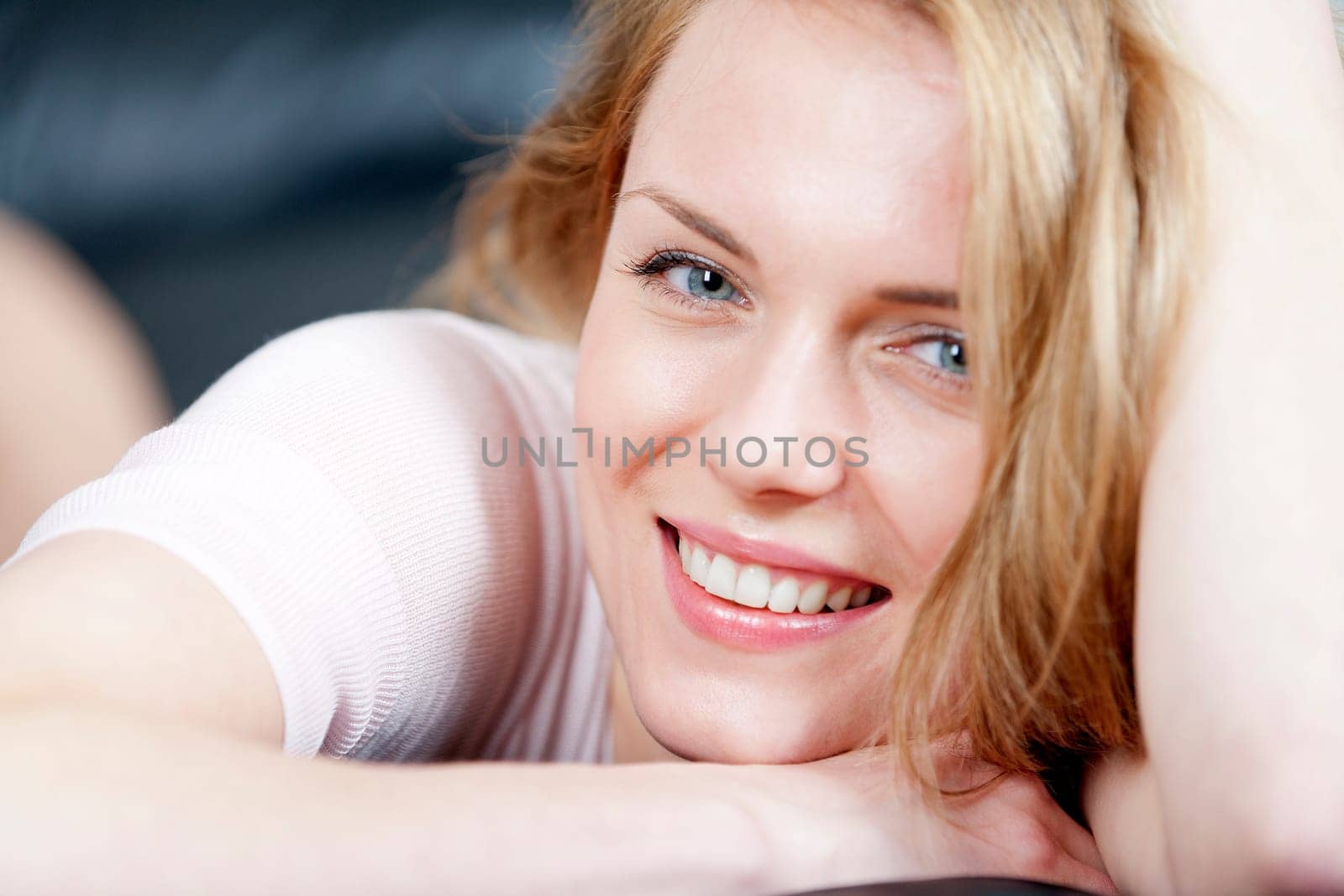 Young woman lying on sofa at home