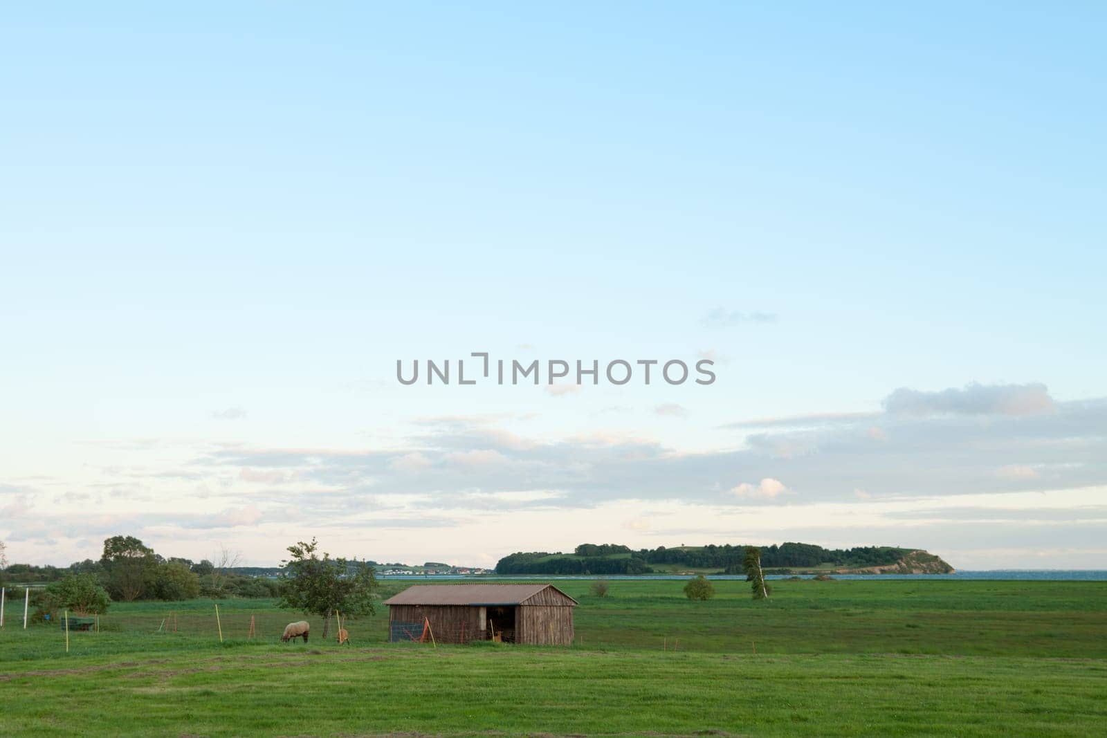 Small wooden stable on a pasture near Zicker
