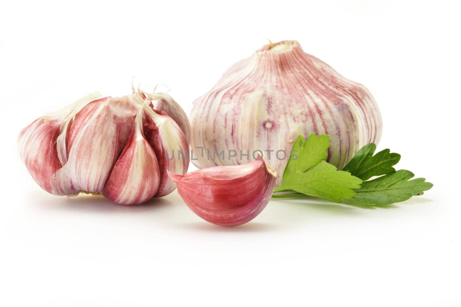 Fresh garlic with parsley isolated on white