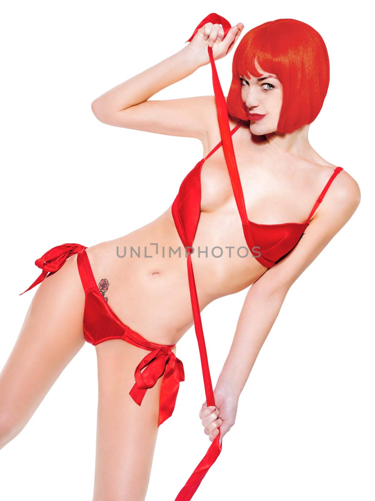 one caucasian sexy seductress woman undressing  in studio isolated on white background
