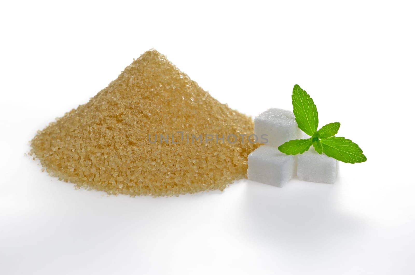 Stevia leaves with sugar cubes and brown cane sugar
