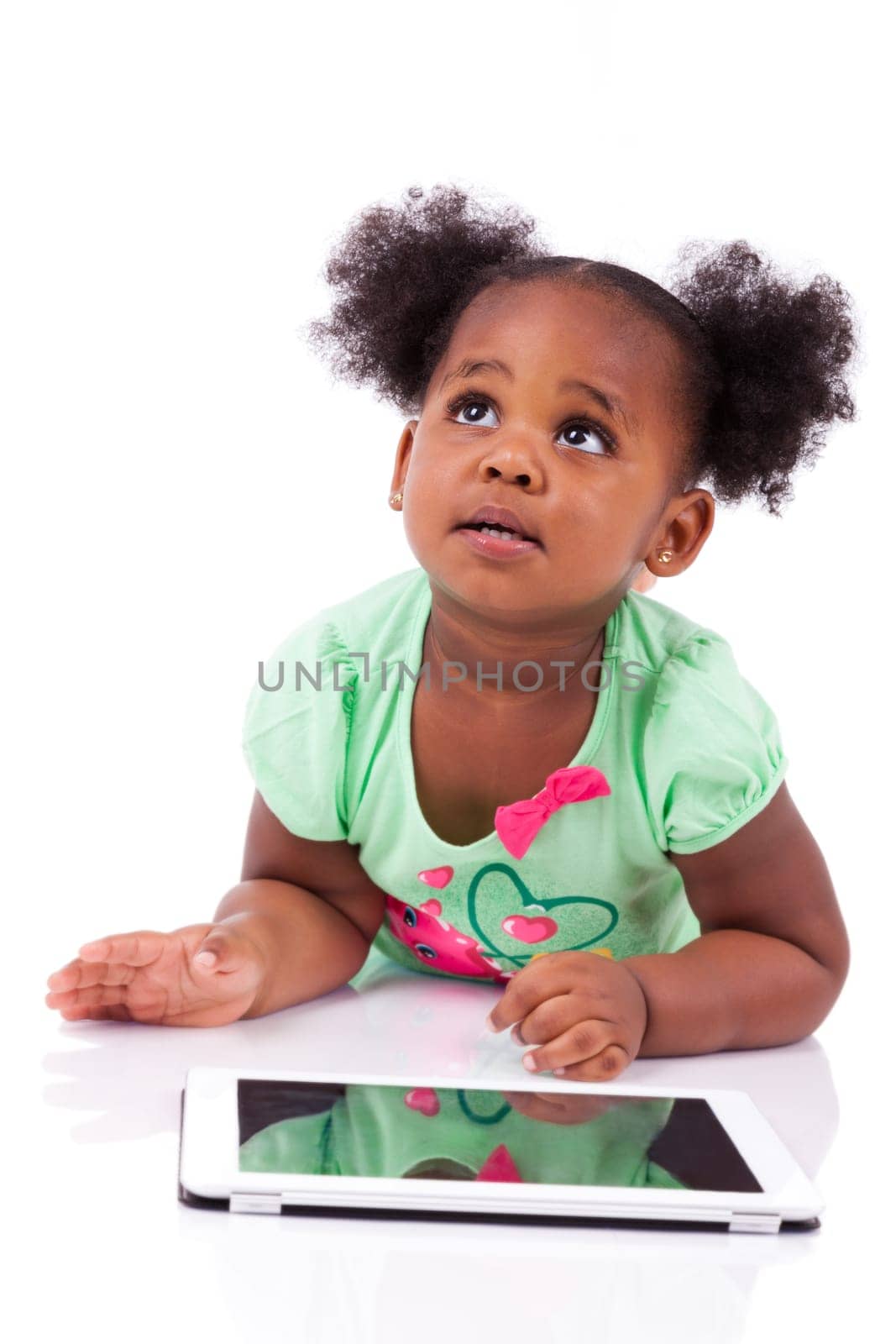 Little african american girl using a tablet  pc, isolated on white background