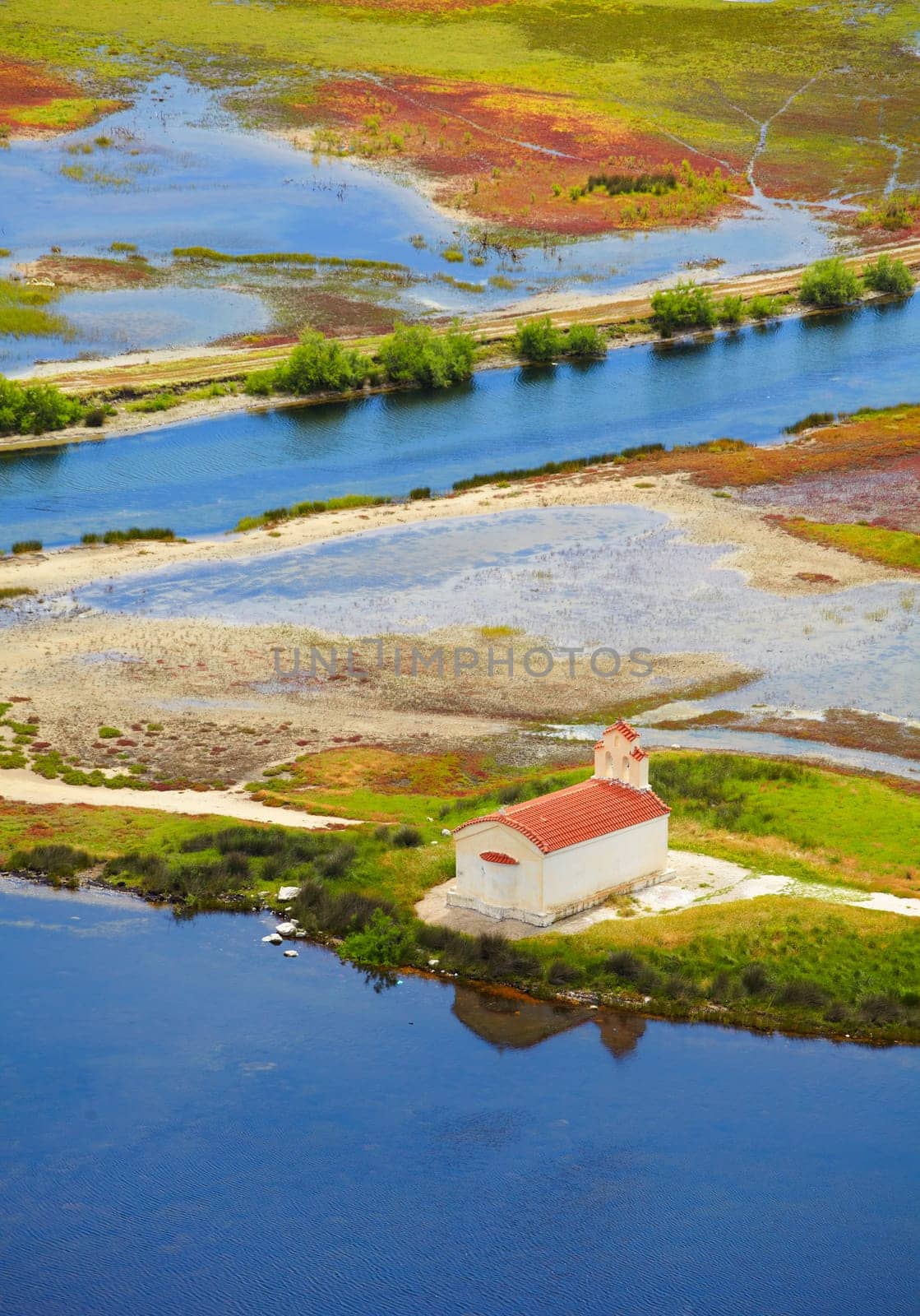 Small chapel in the wetlands of Prokopos Lagoon, Kalogria, Greece.