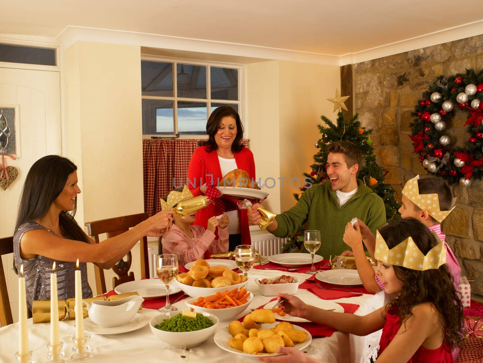 Hispanic family having Christmas dinner