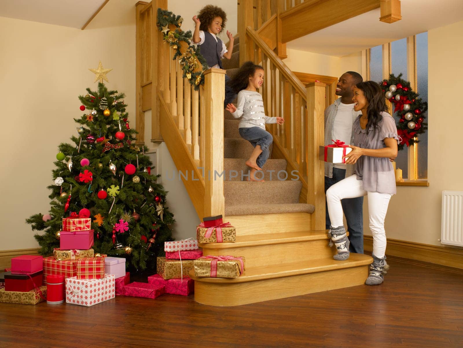 Young mixed race family on Christmas morning