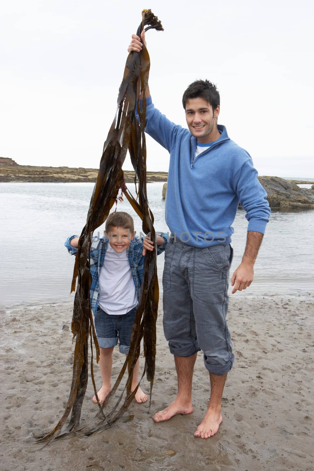 Father and son on beach