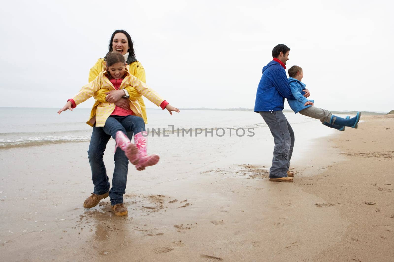 Family playing on beach