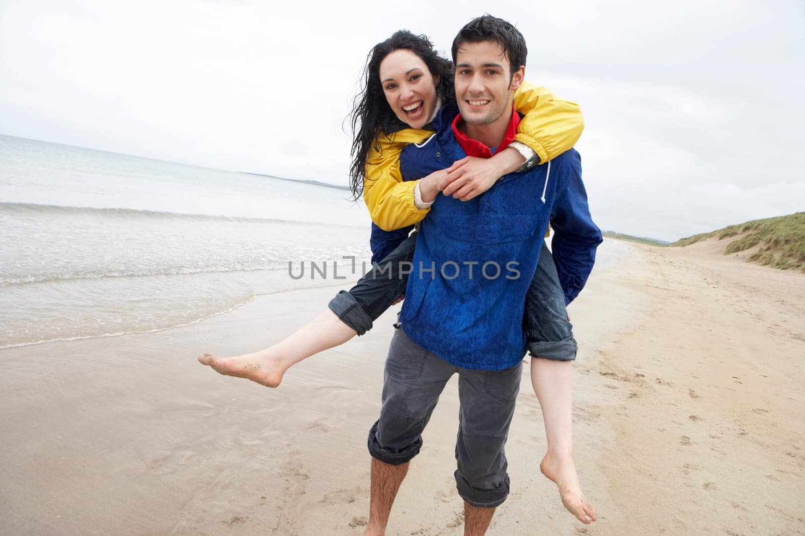 Happy couple on beach in love