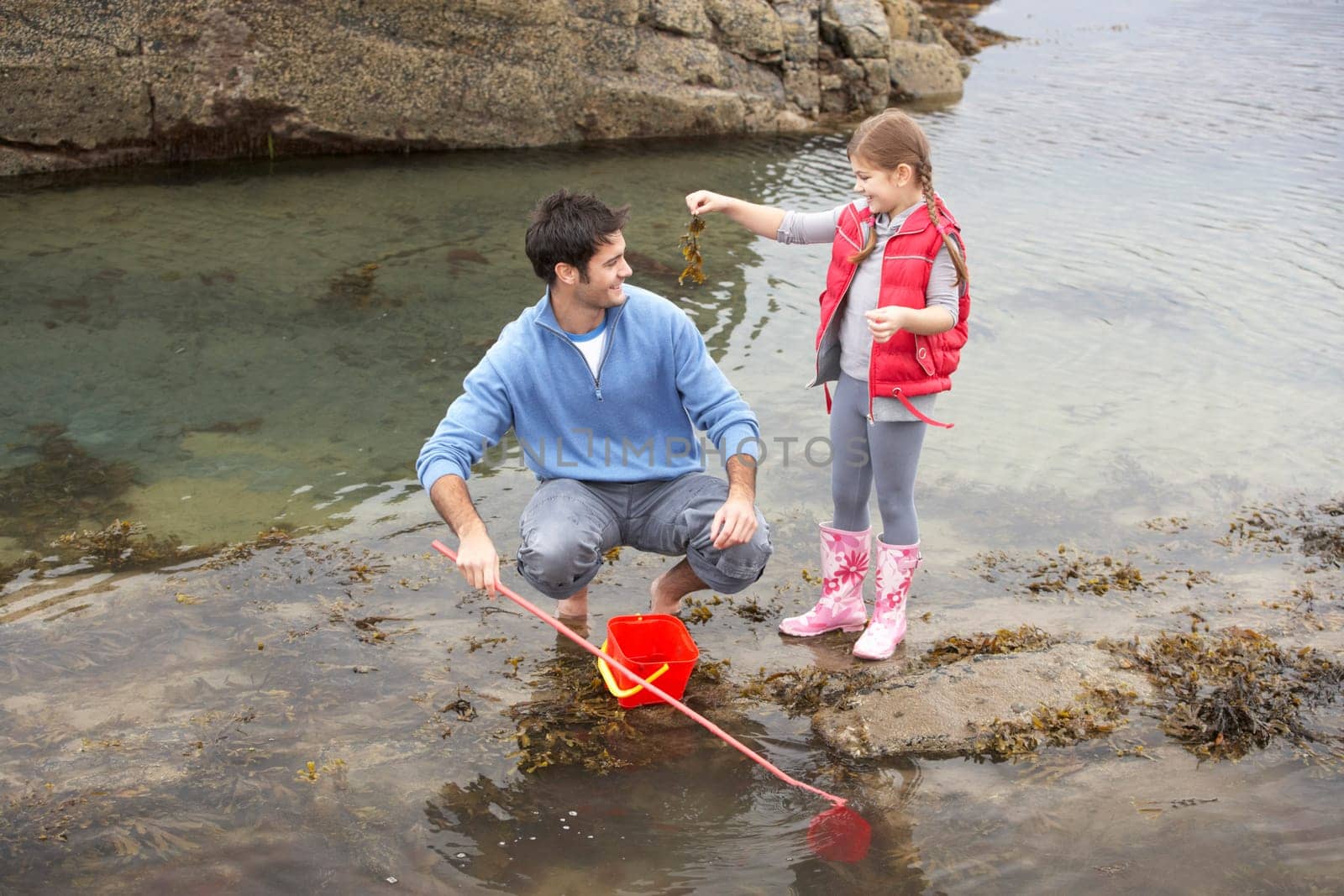 Father with daughter on beach