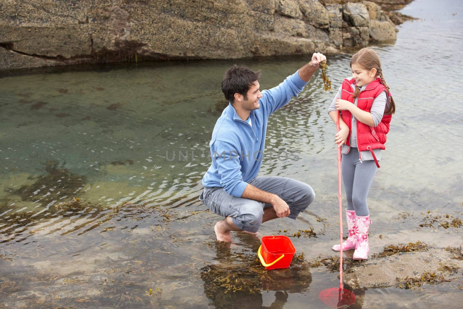 Father with daughter on beach