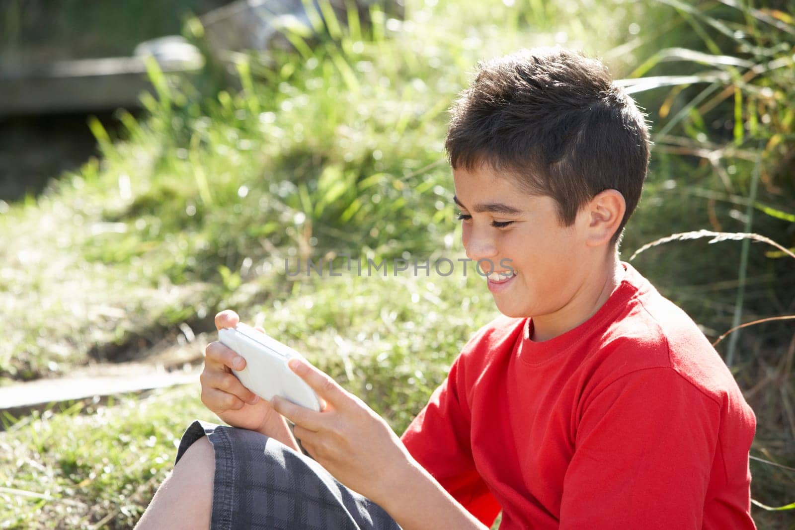 Teenage boy playing with computer game