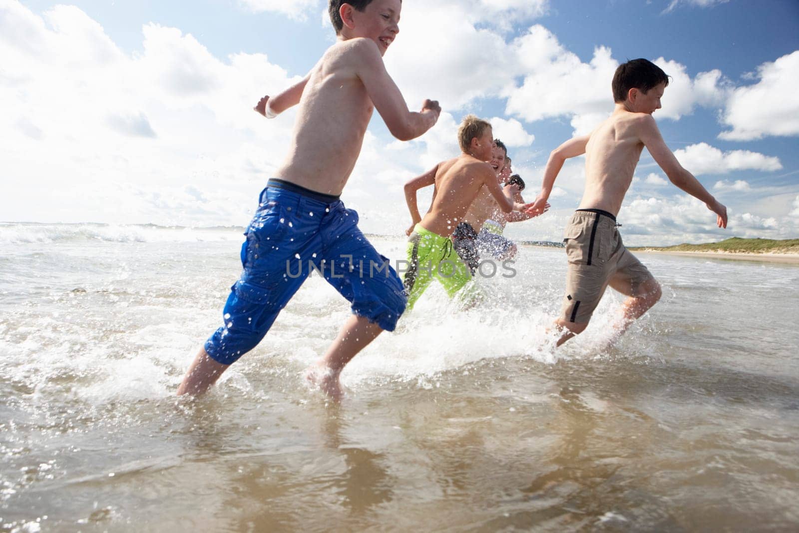 Teenagers playing on beach