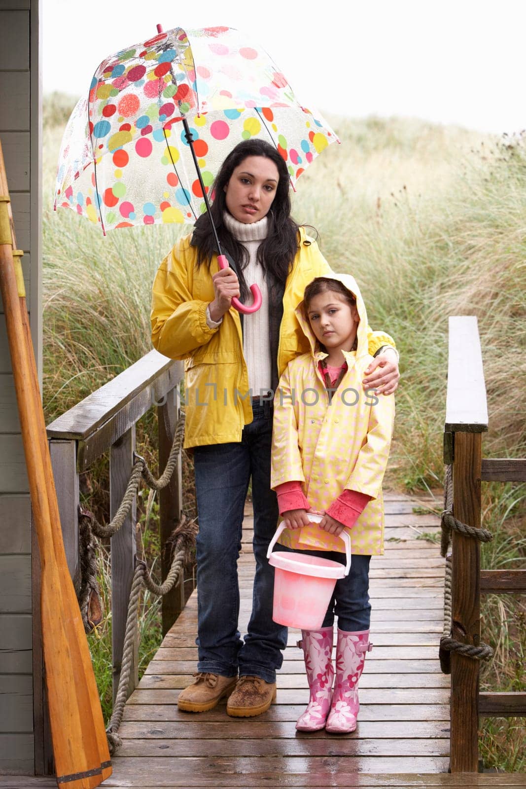 Mother and daughter with umbrella