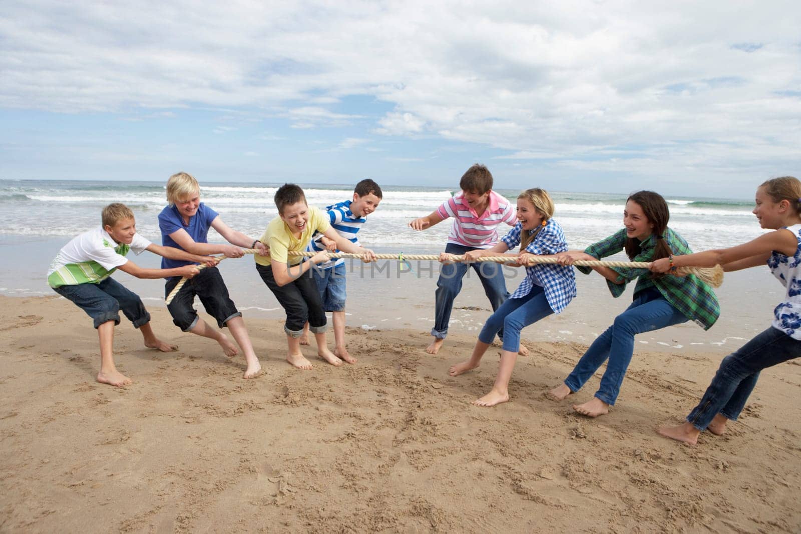 Teenagers playing tug of war