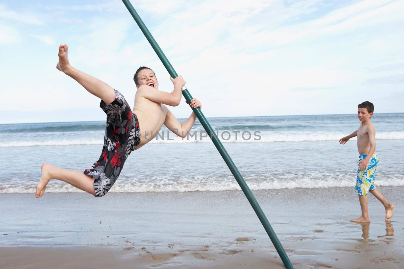Teenagers playing on beach