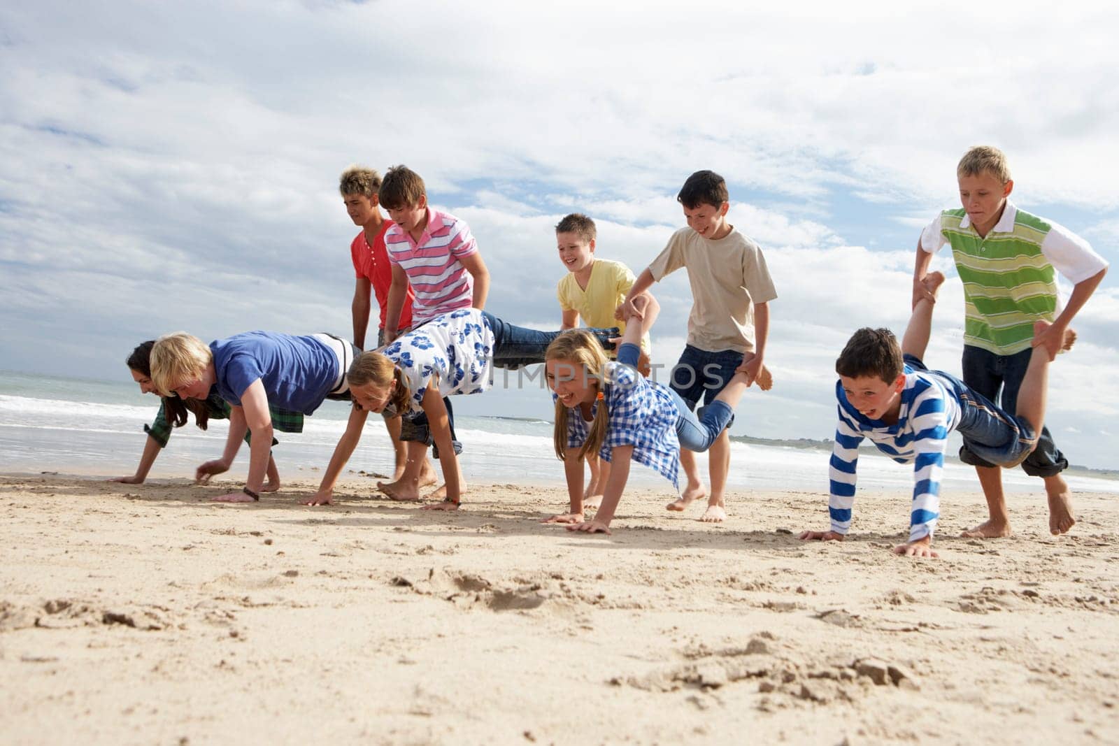 Teenagers playing on beach