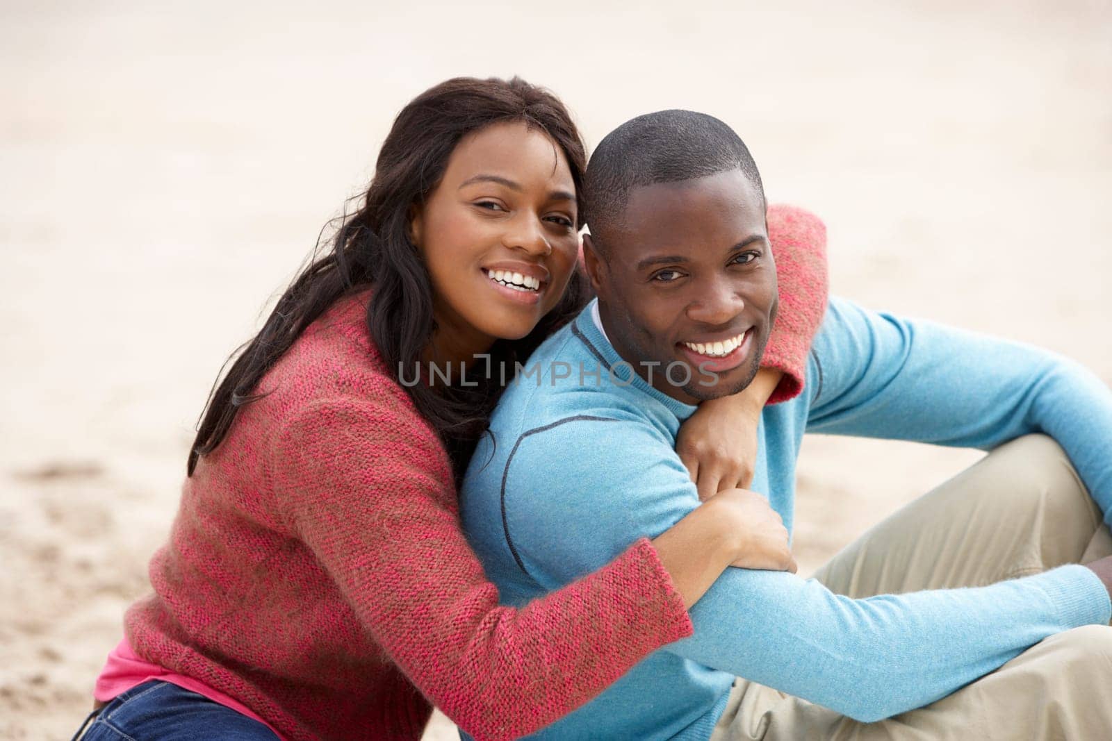 Young couple Embracing on beach