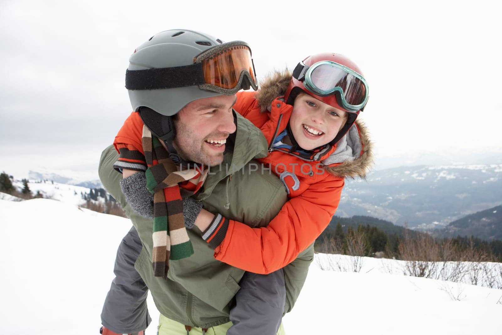 Young Father And Son On Winter Vacation