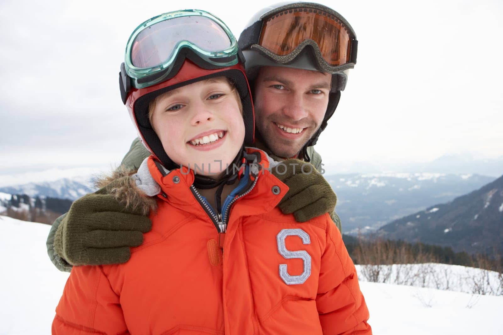 Young Father And Son On Winter Vacation