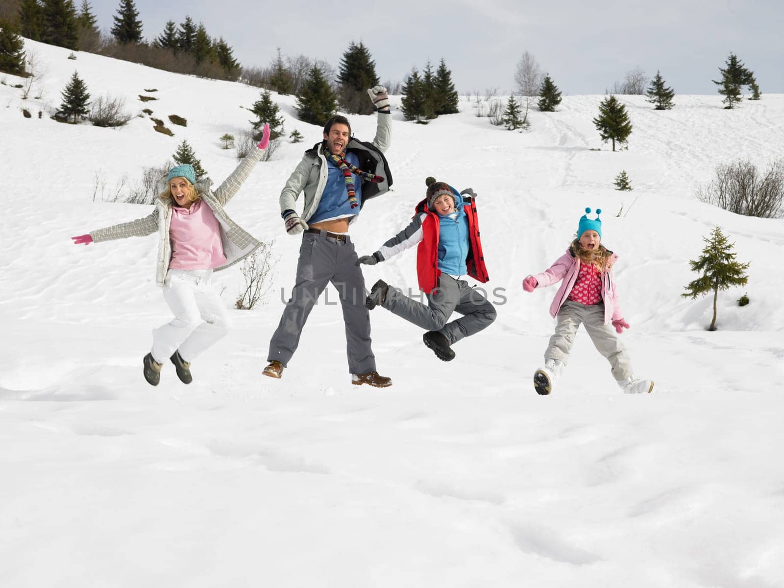 Young Family On Winter Vacation