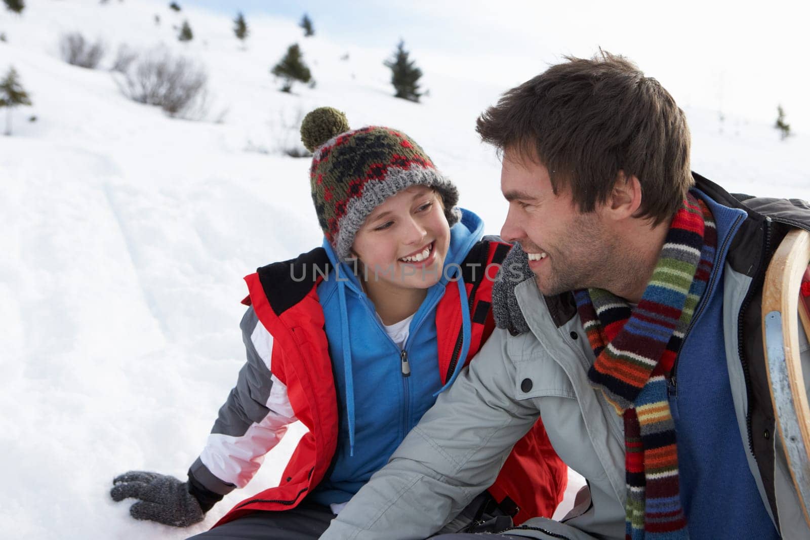 Young Father And Son In Snowy Landscape