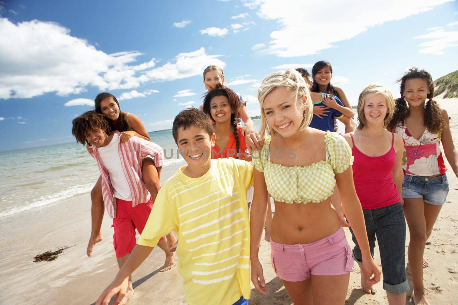 Teenagers walking on beach