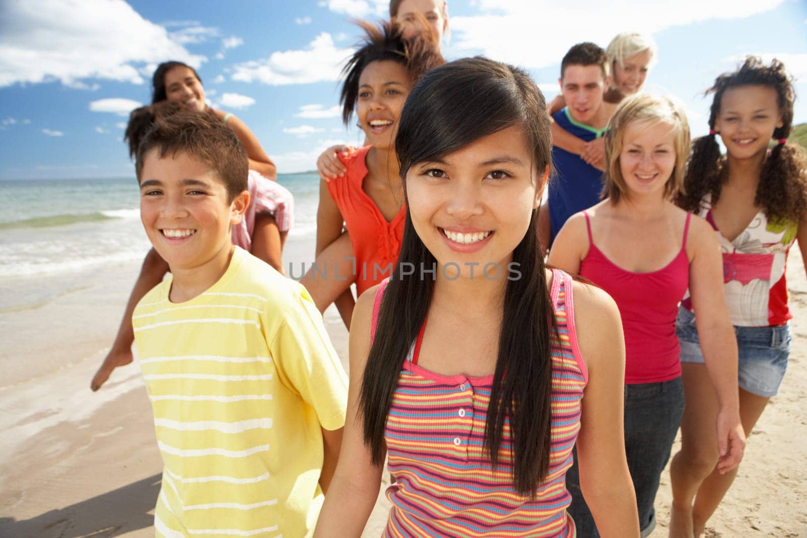 Teenagers walking on beach