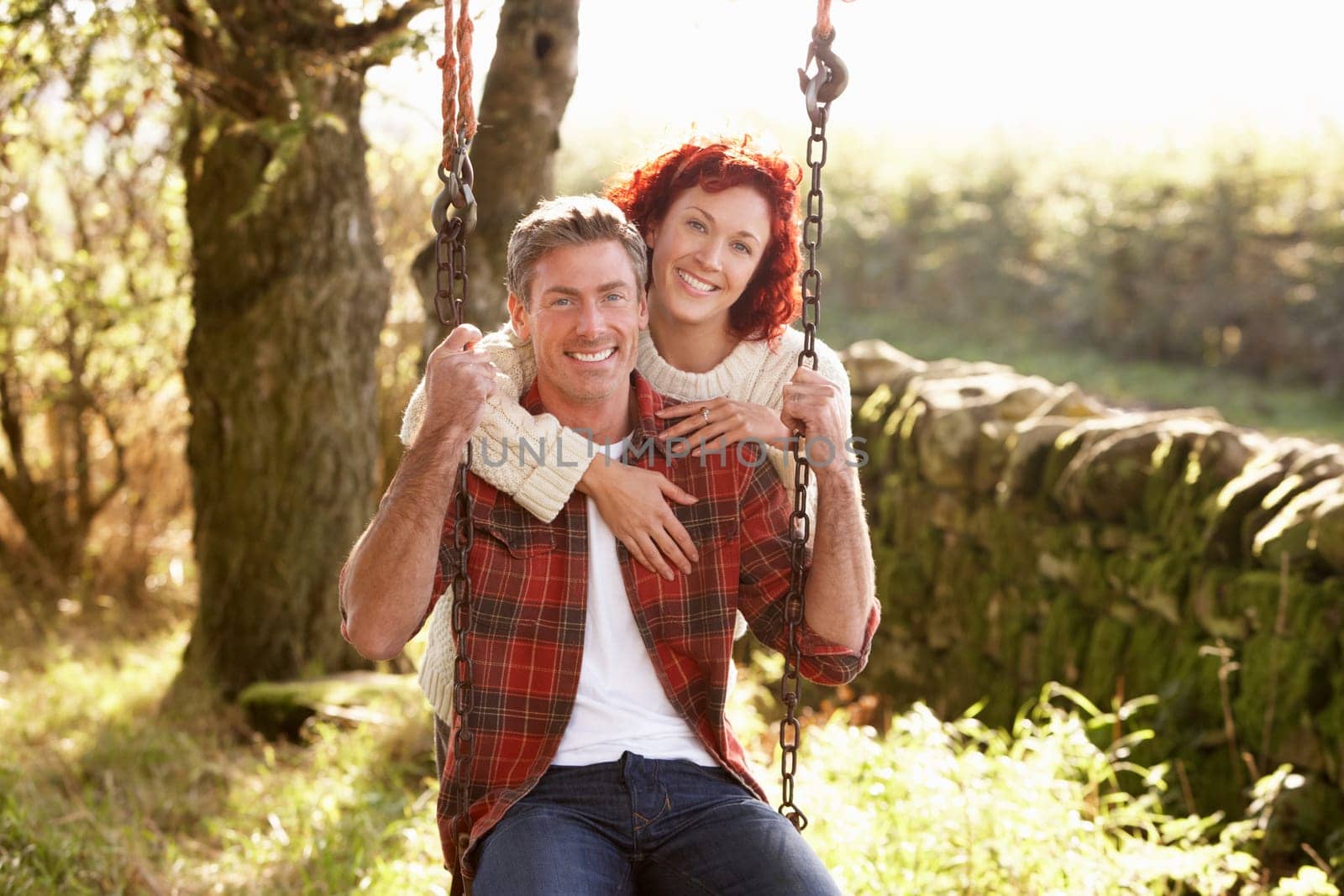 Couple with country garden swing