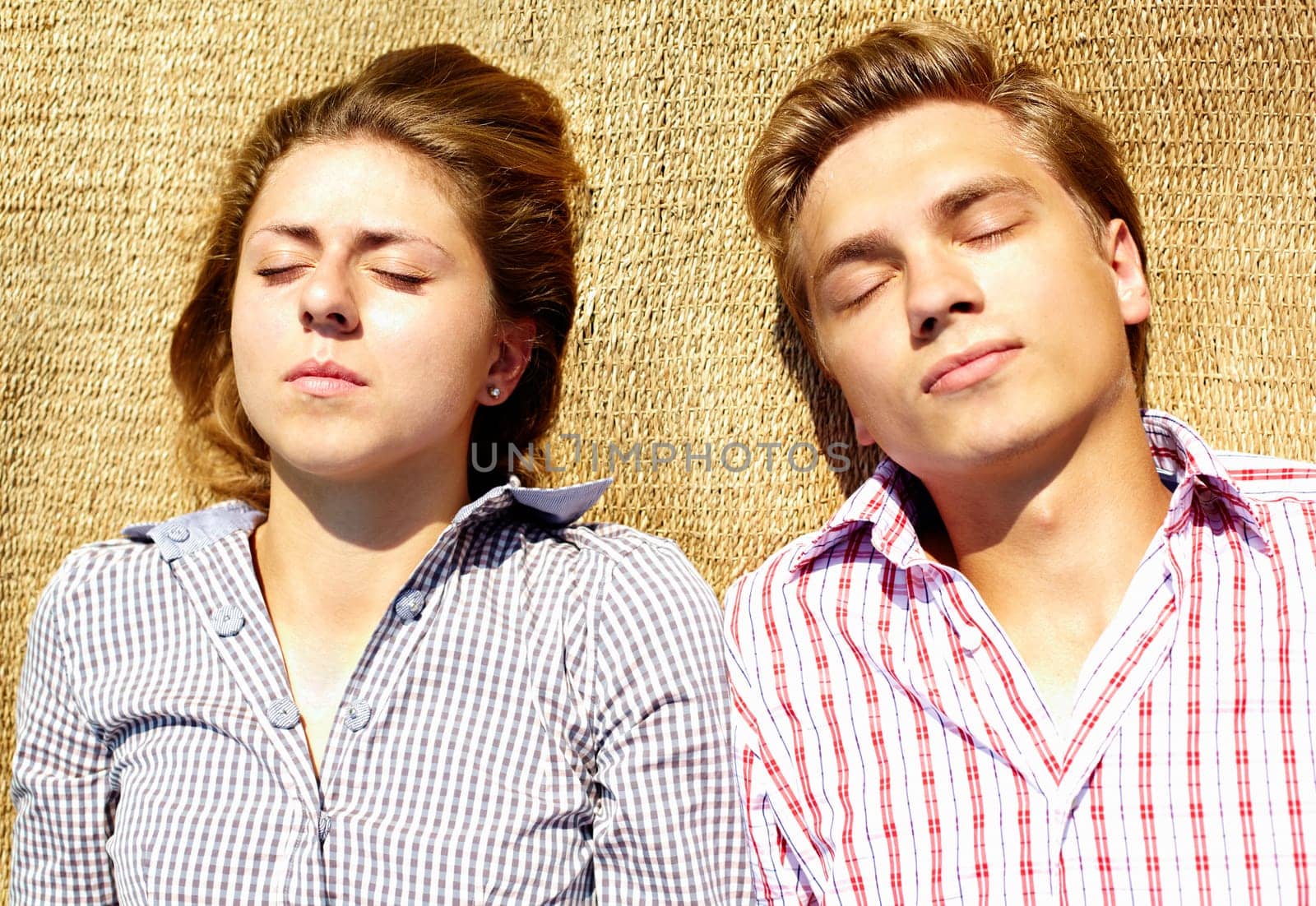 Portrait of young couple having a nap