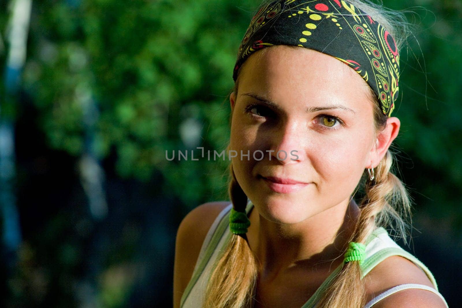 Image of tired sport woman touching her forehead