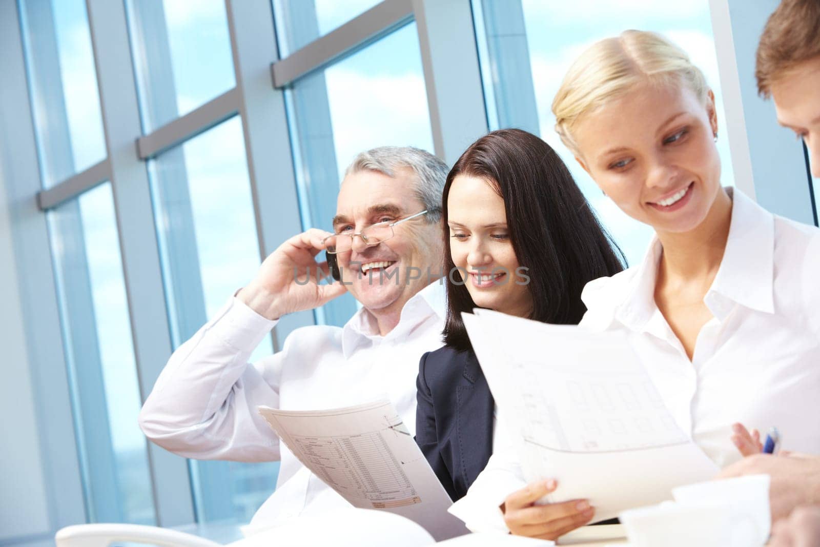 Photo of confident employees working in office