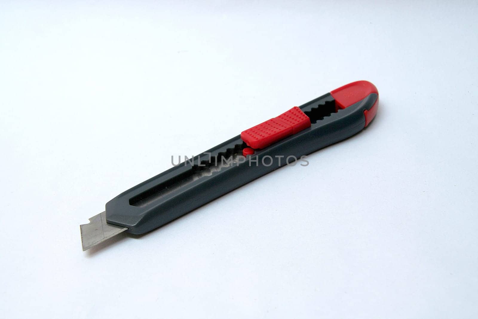 Pointed, sharp-edged paper trimmer used for art work isolated on white background