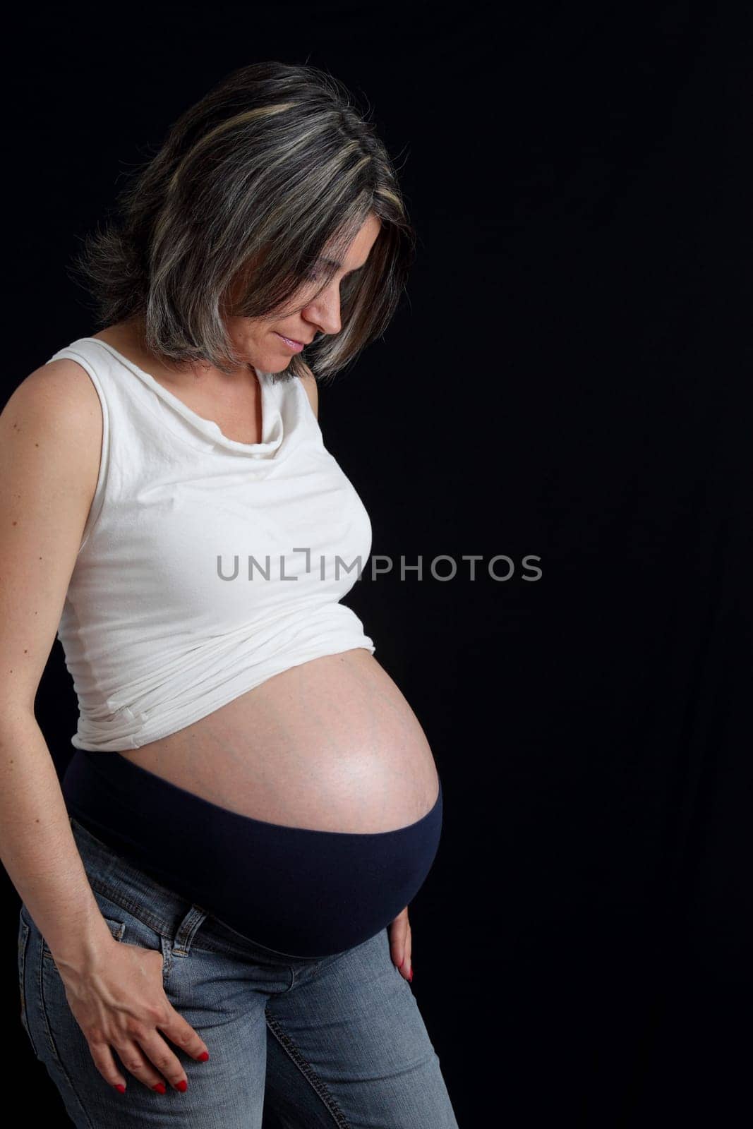 details of side view of a belly of pregnant woman