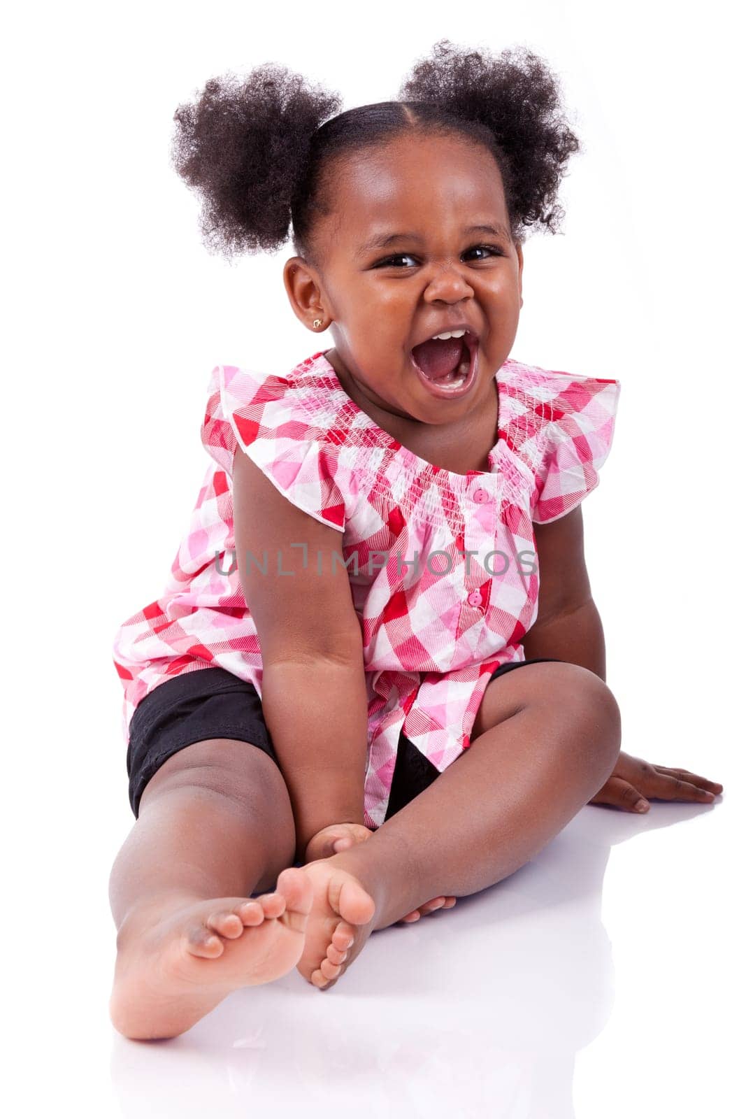 Cute little african american girl laughing, isolated on white background