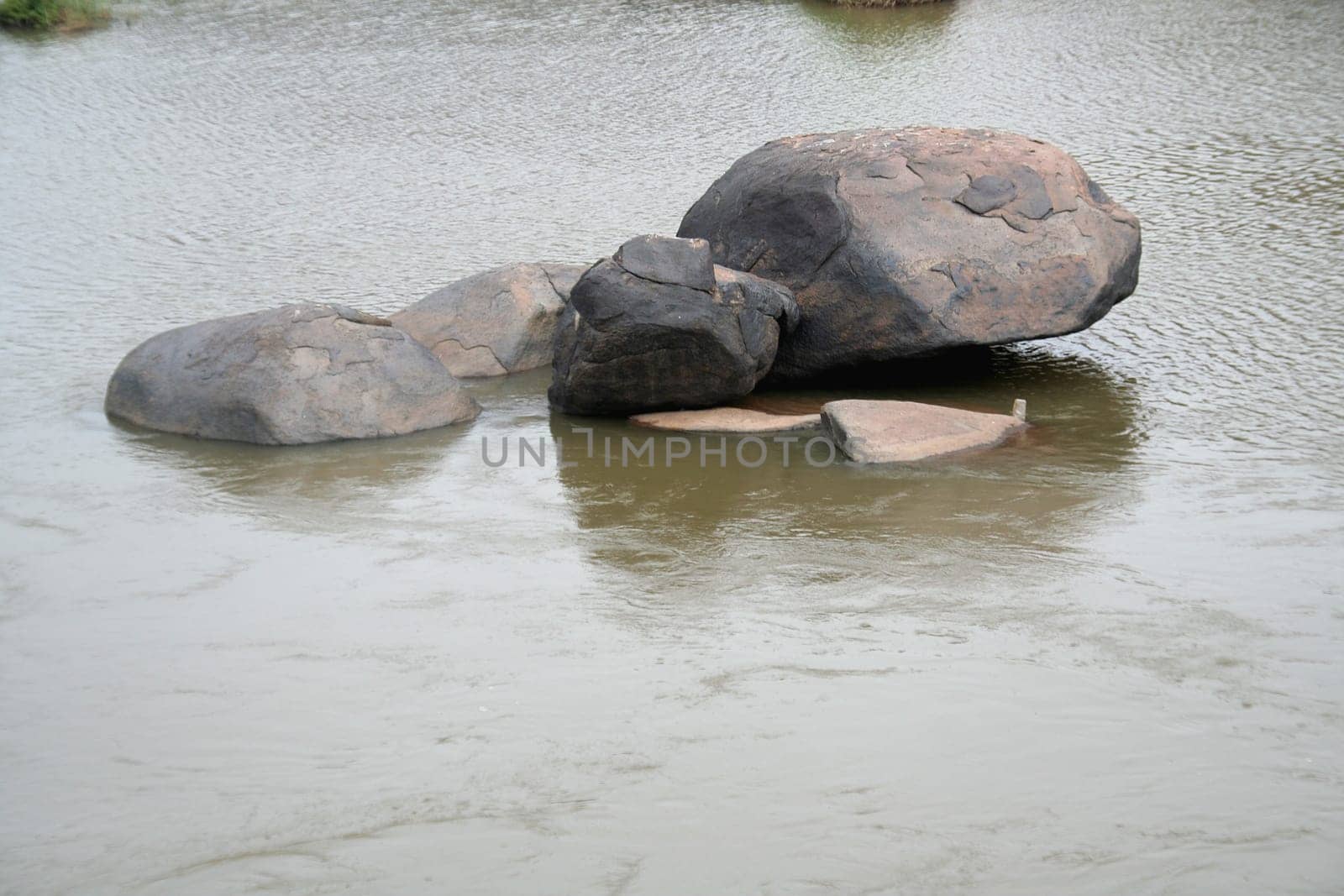 Rocks of myriad shapes amidst river water